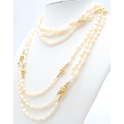 379 - A Three Row Small Baroque Pearl Necklace with Nine, 14K Gold Spacers and Clasp. 76cm length. 48.85g ... 