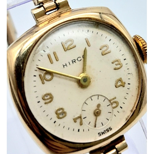 414 - A Vintage 9K Gold Hirco Ladies Watch. 9K gold expandable spring bracelet. 9k gold case - 21mm. White... 