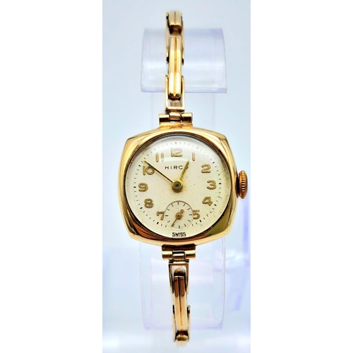 414 - A Vintage 9K Gold Hirco Ladies Watch. 9K gold expandable spring bracelet. 9k gold case - 21mm. White... 