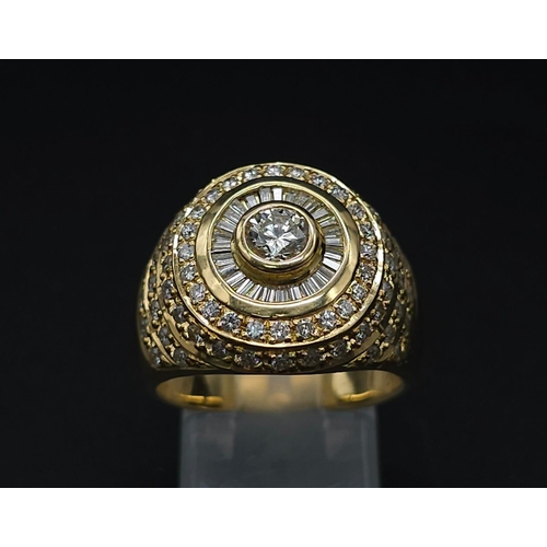 93 - An 18K Yellow Gold and Diamond Bullseye Dress Ring. A central brilliant round cut diamond surrounded... 