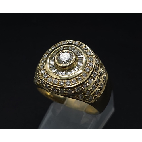 93 - An 18K Yellow Gold and Diamond Bullseye Dress Ring. A central brilliant round cut diamond surrounded... 