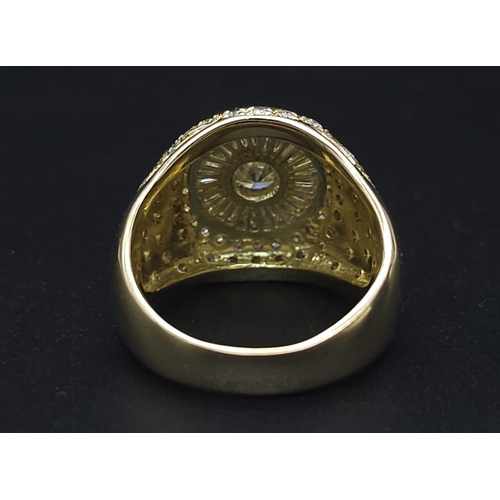 93 - An 18K Yellow Gold and Diamond Bullseye Dress Ring. A central brilliant round cut diamond surrounded... 