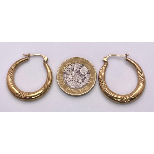 986 - A Pair of Vintage 9K Yellow Gold Hoop Earrings with Diagonal  Engraved Decoration. 1.76g total weigh... 