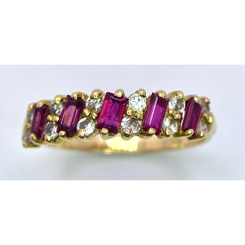 141 - A Beautiful 18K Yellow Gold, Diamond and Ruby Ring. Rectangular cut rubies separated with 12 round c... 