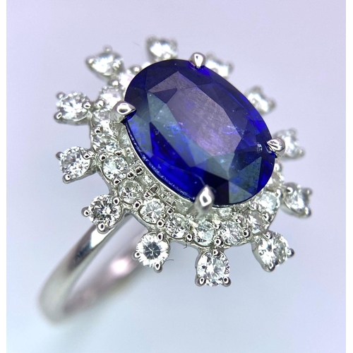 198 - A 950 Platinum, Diamond and Sapphire Ring. Central 2.79ct Sri Lankan oval sapphire with a double hal... 