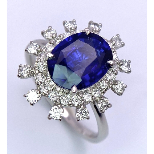 198 - A 950 Platinum, Diamond and Sapphire Ring. Central 2.79ct Sri Lankan oval sapphire with a double hal... 