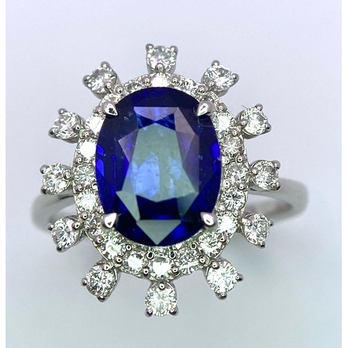 198 - A 950 Platinum, Diamond and Sapphire Ring. Central 2.79ct Sri Lankan oval sapphire with a double hal... 