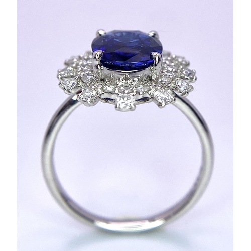 198 - A 950 Platinum, Diamond and Sapphire Ring. Central 2.79ct Sri Lankan oval sapphire with a double hal... 