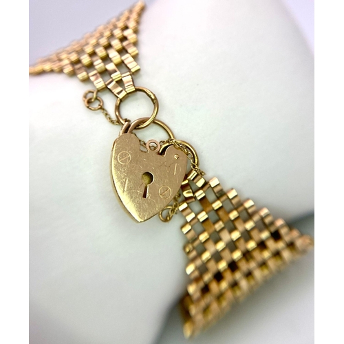 50 - A Vintage 9K Yellow Gold Wide Gate Bracelet with Heart Clasp. 17cm. 34mm wide. 21.2g weight.