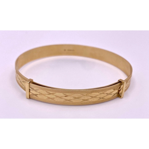 736 - A Vintage 9K Yellow Gold Expandable Child's Bangle. Geometric pattern decoration. 7.17g total weight... 