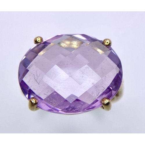 771 - A Vintage 9K Yellow Gold Amethyst Ring. 15ct faceted amethyst. Size R. 6.15g total weight.