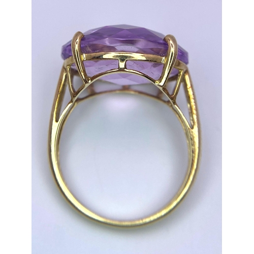 771 - A Vintage 9K Yellow Gold Amethyst Ring. 15ct faceted amethyst. Size R. 6.15g total weight.