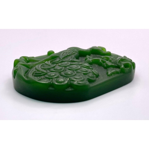 1318 - A Chinese Green Jade Decorative Peacock Pendant. 5cm