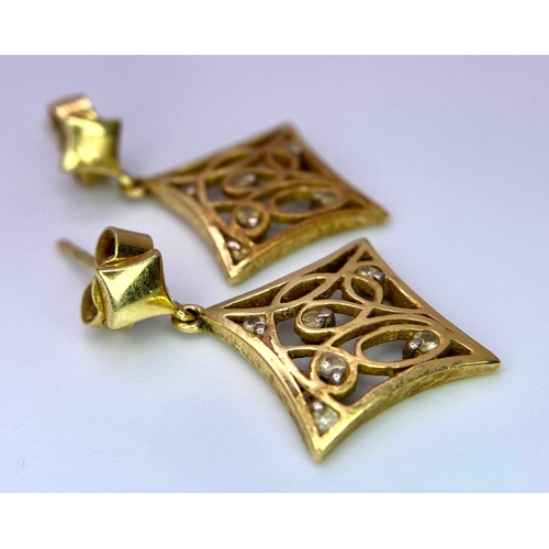 1507 - A Pair of Vintage 18K Gold and Diamond Decorative Celtic Style Earrings. 4.33g total weight.