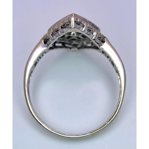 253 - A Platinum, Diamond and Sapphire Ring. Central round cut diamond with a square cut sapphire and furt... 