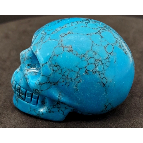 471 - A Blue Turquoise Hand-Carved Skull Figure. Curiosity or small paperweight. 5cm x 4cm.