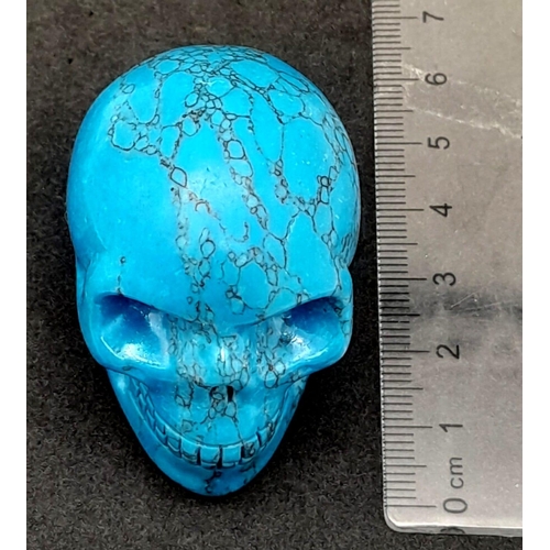 471 - A Blue Turquoise Hand-Carved Skull Figure. Curiosity or small paperweight. 5cm x 4cm.