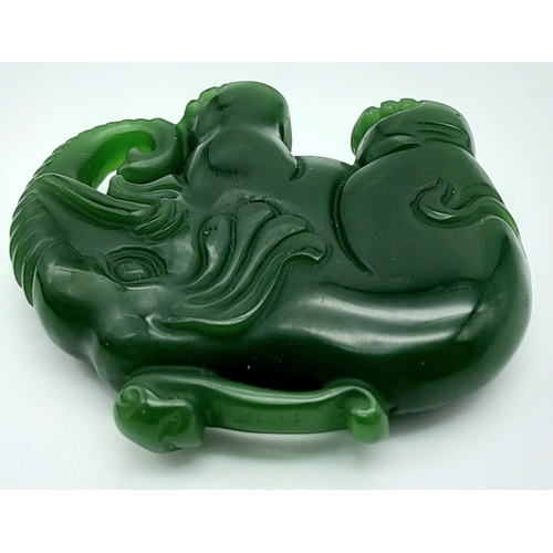 549 - A Green Jade Chinese Hand-Carved Elephant Pendant. 5cm x 4cm.