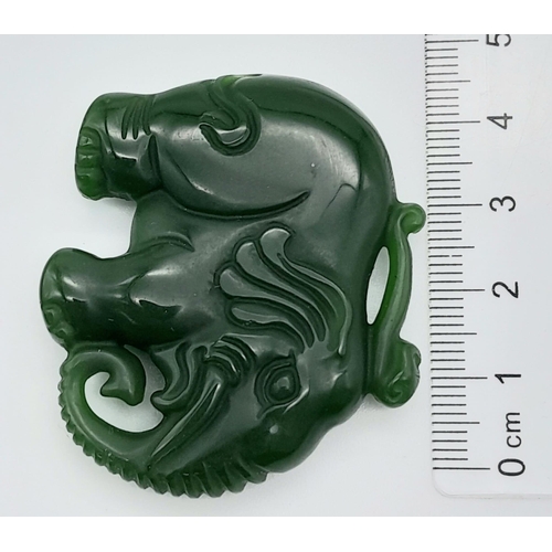 549 - A Green Jade Chinese Hand-Carved Elephant Pendant. 5cm x 4cm.