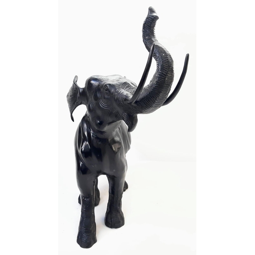 589 - Beautiful Bronze Black Elephant. 
Standing at 52cm tall, this majestic bronze elephant with raised t... 