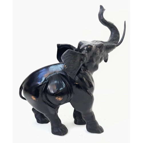 589 - Beautiful Bronze Black Elephant. 
Standing at 52cm tall, this majestic bronze elephant with raised t... 