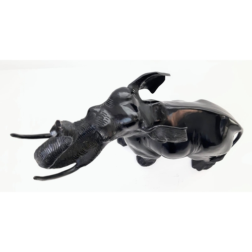 589 - Beautiful Bronze Black Elephant. 
Standing at 52cm tall, this majestic bronze elephant with raised t... 