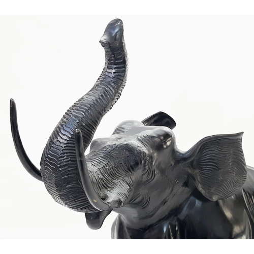 589 - Beautiful Bronze Black Elephant. 
Standing at 52cm tall, this majestic bronze elephant with raised t... 