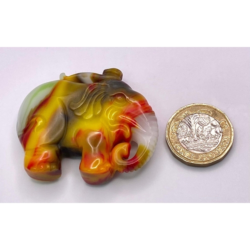 883 - A Multi-Colour Jade Hand-Carved Elephant Pendant. 5cm x 4cm