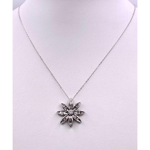 149 - 18KT White Gold Diamond Flower Pendant on a 9KT White Gold Necklace. Pendant is expertly crafted wit... 