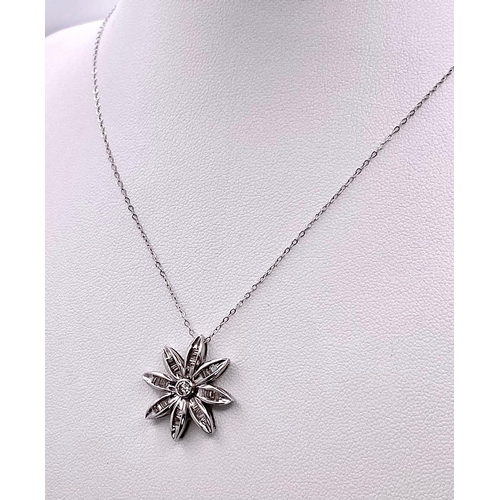 149 - 18KT White Gold Diamond Flower Pendant on a 9KT White Gold Necklace. Pendant is expertly crafted wit... 