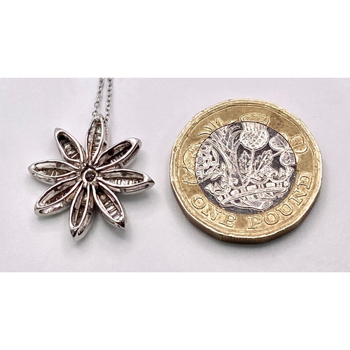 149 - 18KT White Gold Diamond Flower Pendant on a 9KT White Gold Necklace. Pendant is expertly crafted wit... 