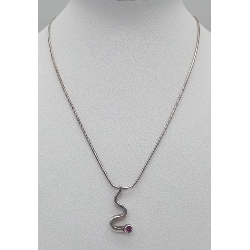 1496 - A 925 silver pink Topaz snake pendant on silver snake chain. Total weight 7.24G. Total length 41cm.