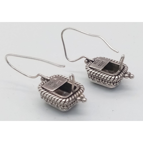 1594 - A pair of 925 silver smoky Topaz earrings. Total weight 11.3G.