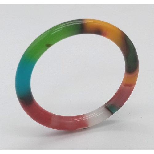 1599 - A Kaleidoscopic Thin Jade Bangle. 6cm inner diameter. 8mm width.