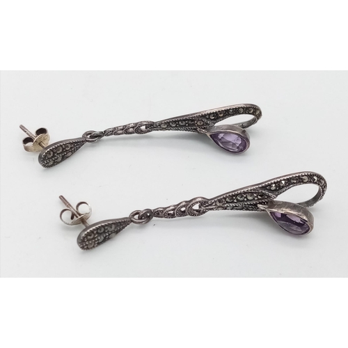 1608 - A pair of vintage 925 silver Amethyst tear drop earrings. Total weight 5.8G. 5.5cm drop.