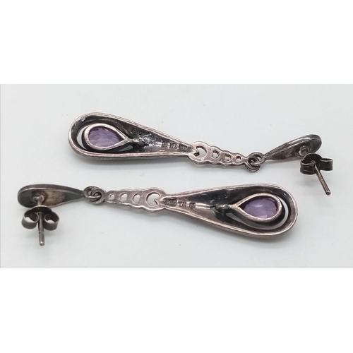 1608 - A pair of vintage 925 silver Amethyst tear drop earrings. Total weight 5.8G. 5.5cm drop.