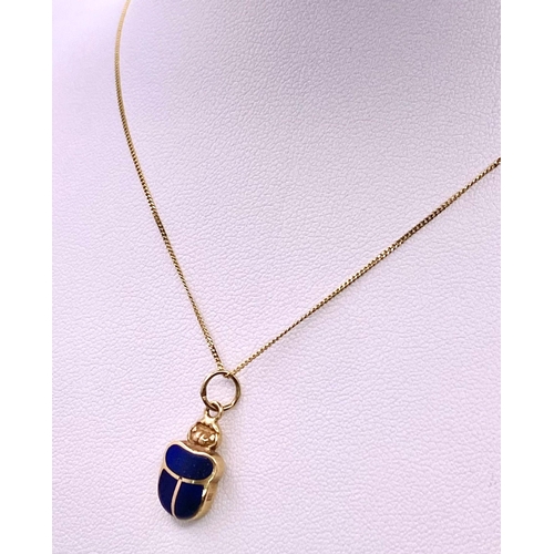 1629 - A 9KT Yellow Gold Necklace with an Egyptian Hallmarked 9KT Gold Scarab Pendant. Scarabs are universa... 