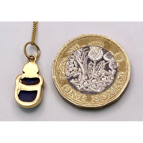 1629 - A 9KT Yellow Gold Necklace with an Egyptian Hallmarked 9KT Gold Scarab Pendant. Scarabs are universa... 