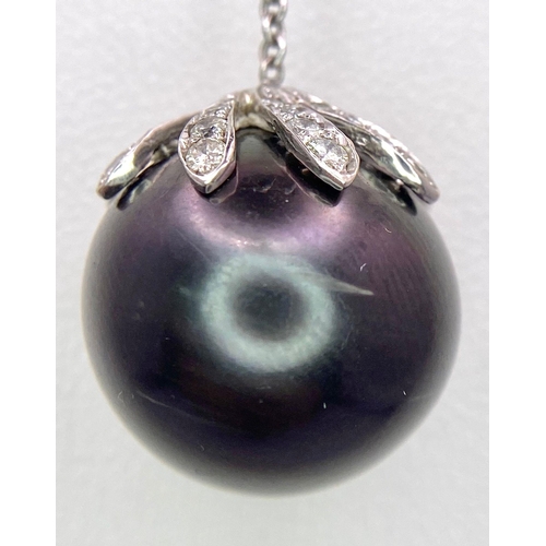 163 - An 18KT White Gold Necklace with a Tahitian Pearl, 5.5CTW Diamond encrusted Pendant. The beautifully... 