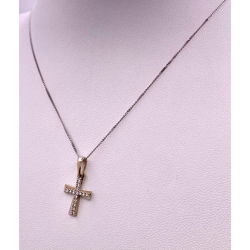 1650 - An 18KT White Gold, Double Crucifix Pendant on a 9KT White Gold Necklace.
Measuring 48cm in length.
... 