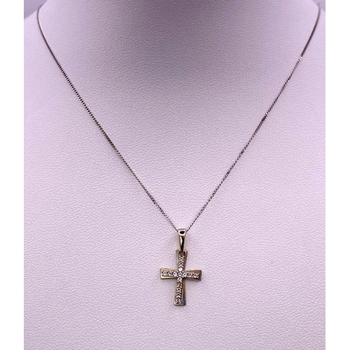 1650 - An 18KT White Gold, Double Crucifix Pendant on a 9KT White Gold Necklace.
Measuring 48cm in length.
... 