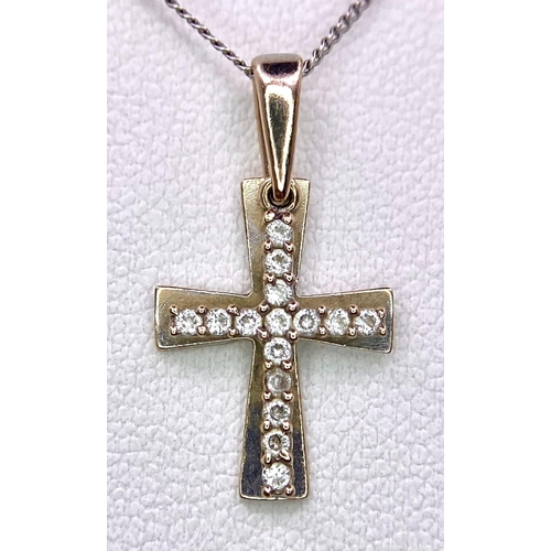 1650 - An 18KT White Gold, Double Crucifix Pendant on a 9KT White Gold Necklace.
Measuring 48cm in length.
... 