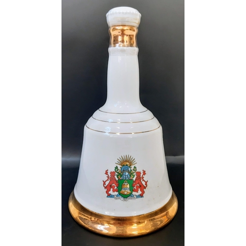 1654 - A Bottle of Commemorative Bells 43% Scotch Whisky 1986 75cl, in Wade Porcelain Decanter.