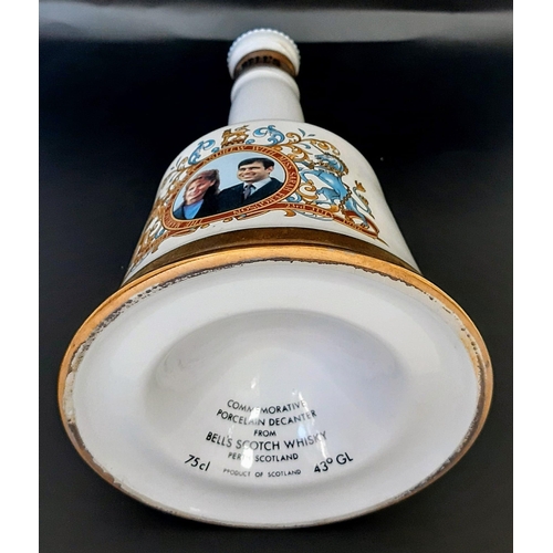 1654 - A Bottle of Commemorative Bells 43% Scotch Whisky 1986 75cl, in Wade Porcelain Decanter.