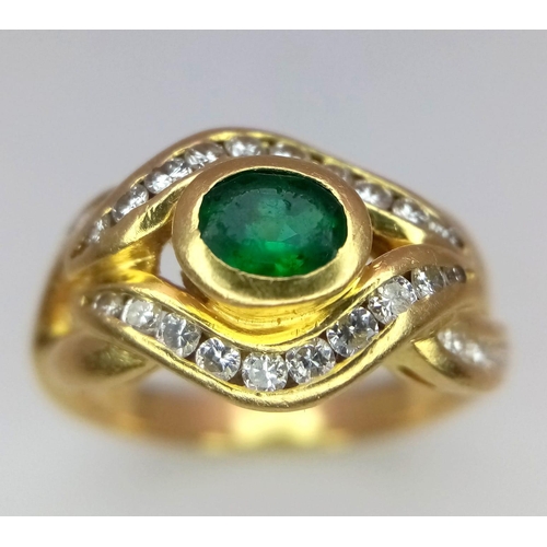 184 - An 18K Yellow Gold Emerald and Diamond Ring. Central oval emerald eye with beautiful diamond lids! 3... 