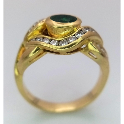 184 - An 18K Yellow Gold Emerald and Diamond Ring. Central oval emerald eye with beautiful diamond lids! 3... 