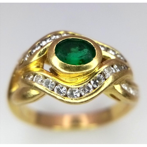 184 - An 18K Yellow Gold Emerald and Diamond Ring. Central oval emerald eye with beautiful diamond lids! 3... 