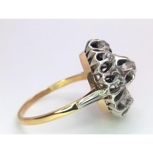 191 - An 18K Yellow and White Gold Diamond Ring. Central brilliant round cut diamond with an eight brillia... 