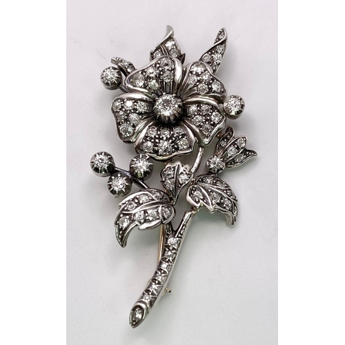 298 - An Antique 18K Gold and Diamond Floral Brooch. This beautifully constructed masterpiece has a brilli... 