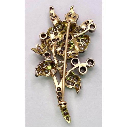 298 - An Antique 18K Gold and Diamond Floral Brooch. This beautifully constructed masterpiece has a brilli... 